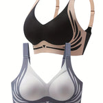 Black and beige bra on top, white and gray bra below on a white background