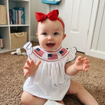 Tiny&Thrive Smocked Baby Girl Clothes – 4th of July Bubble Romper with Fly Sleeves & American Flag Embroidery | Patriotic Infant Outfit