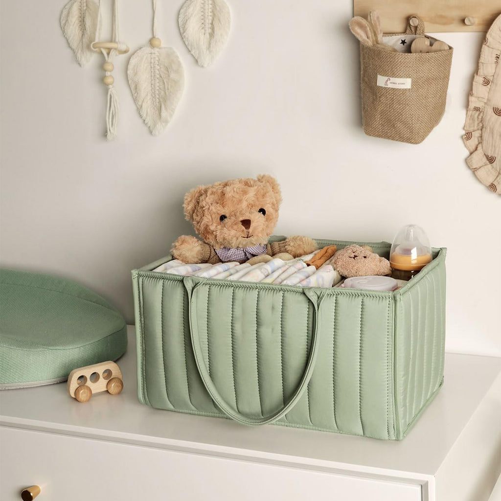 Green storage box with toys on a shelf in a child's room