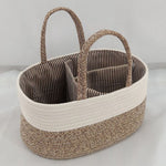 Woven basket with striped interior on a light gray background