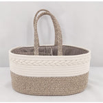 Woven basket with striped interior on a light gray background