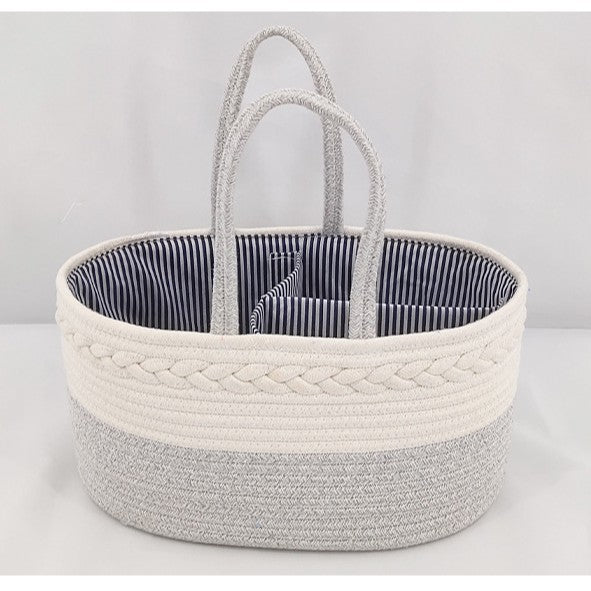 Woven basket with striped interior on a light gray background