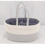 Woven basket with striped interior on a light gray background
