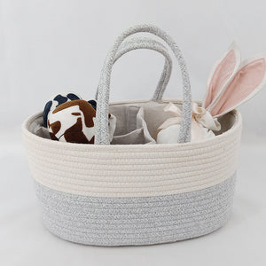 Woven basket with toys on a light background