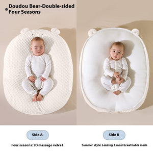 Baby in a double-sided baby nest with different textures on each side.
