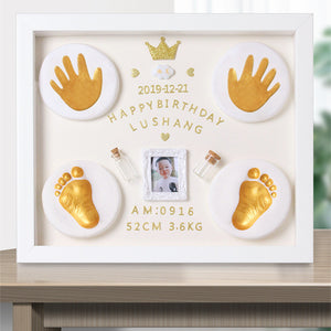 Decorative frame with gold hand and footprints, photo, and text on a white background