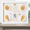 Decorative frame with gold hand and footprints, photo, and text on a white background