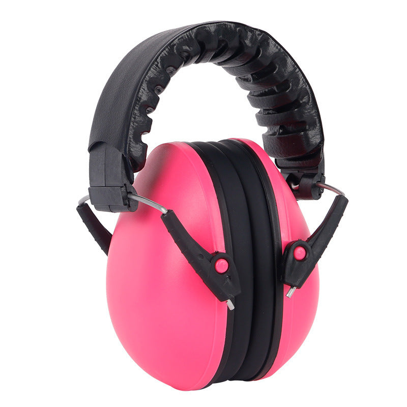 Pink and black ear protectors on a white background