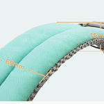 Close-up of a green belt with measurement labels on a light gray background
