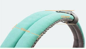 Close-up of a green belt with measurement labels on a light gray background