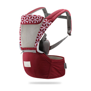 Red baby carrier with geometric pattern on a white background