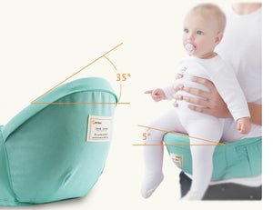 Baby in a green baby carrier with measurements indicated