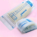 Roll of clear plastic bags with measurement markings on a pink background