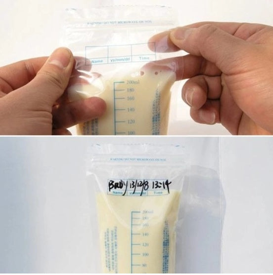 Hands holding a breast milk storage bag with measurement markings and a label.