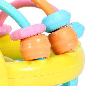 Colorful baby toy with beads and rings on a white background