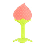 Pink and green silicone teething toy on a white background