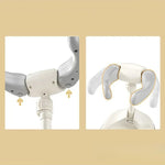 Two views of a white and gray mechanical arm on a beige background