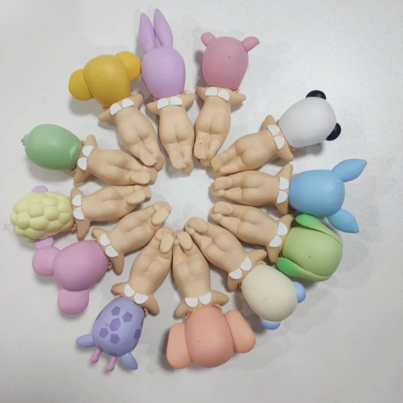 Colorful silicone teether toys arranged in a circular pattern on a light gray background