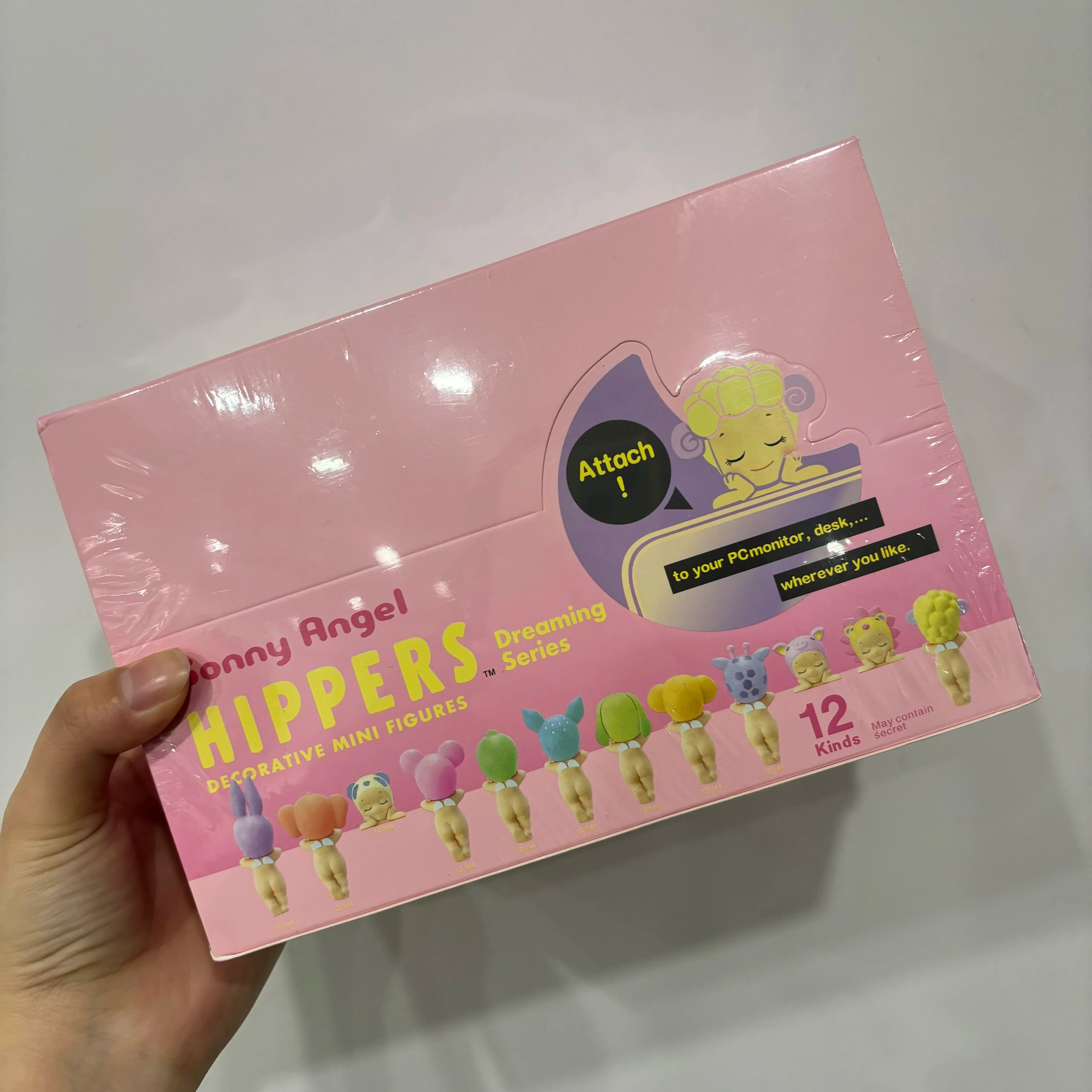 Pink packaging of Tonny Angel Hippers with toy figures on a white background