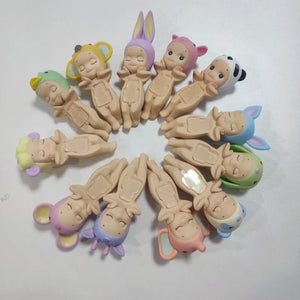 Set of small figurines with colorful hair accessories arranged in a circular pattern on a white background.