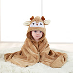 Baby wrapped in a brown animal-themed hooded towel on a white surface