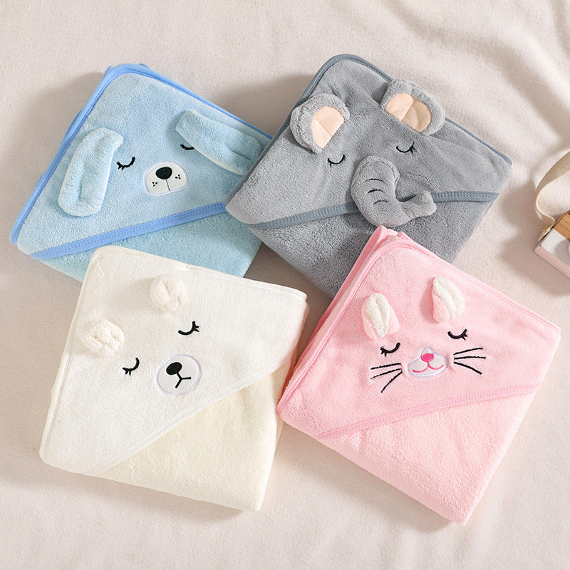 Four baby hooded towels with animal designs on a light background