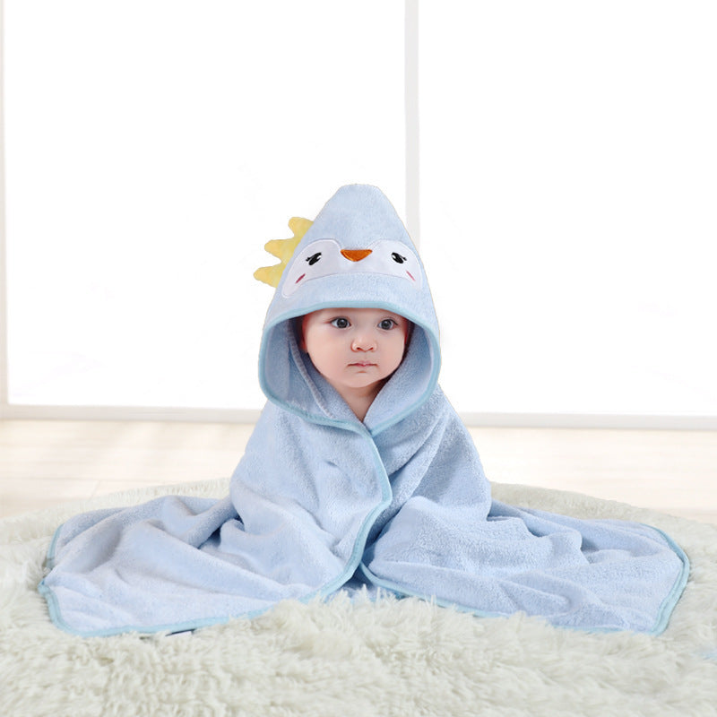 Baby wrapped in a blue hooded towel with a cartoon character on a white background
