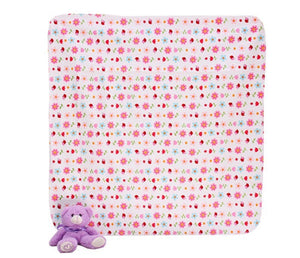Floral-patterned blanket with a purple teddy bear on a white background