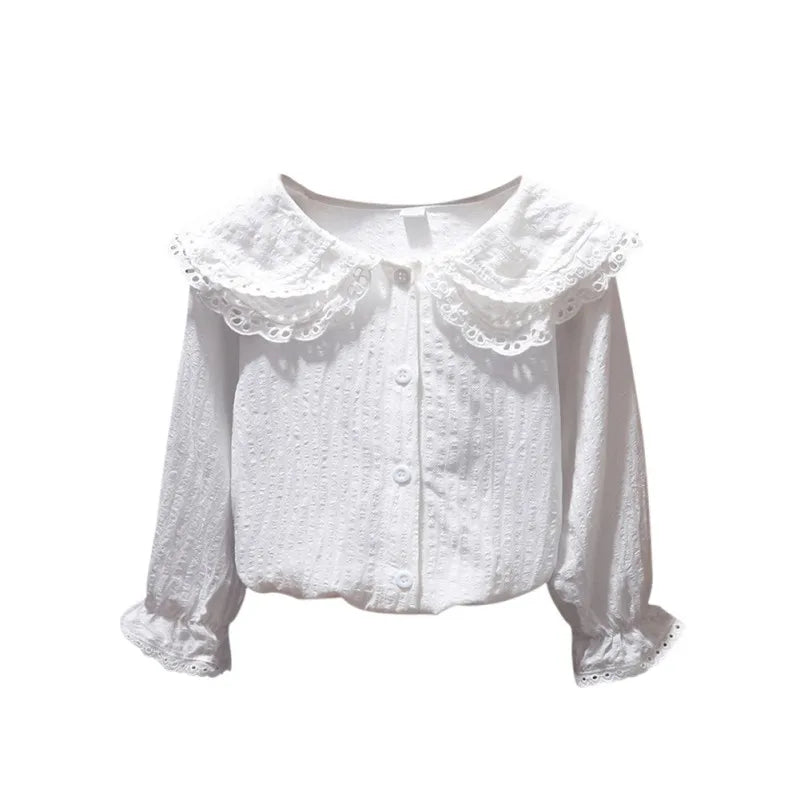 White blouse with lace collar on a white background