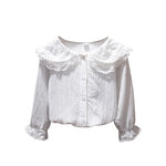 White blouse with lace collar on a white background