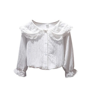 White blouse with lace collar on a white background