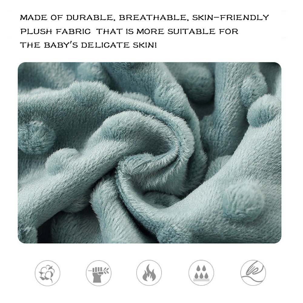 Close-up of plush fabric with text about its suitability for baby skin and safety icons below.