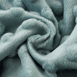 Close-up of a textured light blue fabric