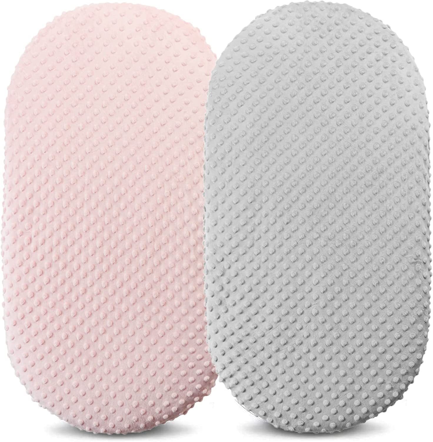 Two textured cushions, one pink and one gray, on a white background