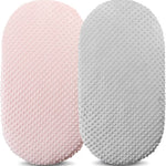 Two textured cushions, one pink and one gray, on a white background