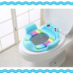 Children's toilet seat with rainbow design on a toilet