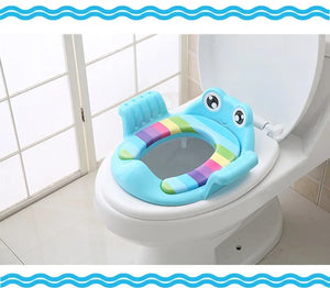 Children's toilet seat with rainbow design on a toilet
