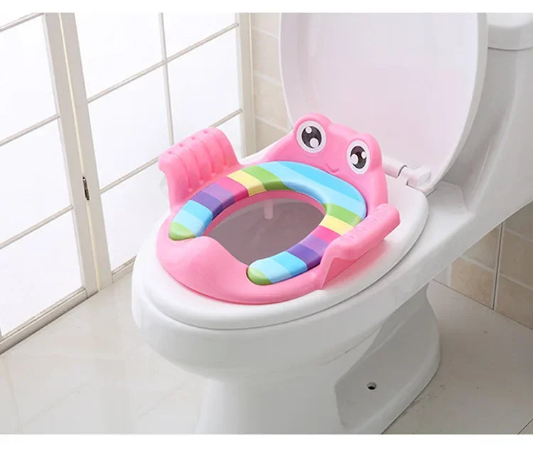 Colorful children's toilet seat on a toilet in a bathroom setting