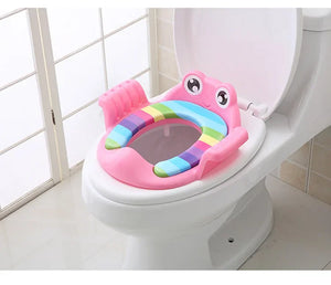 Colorful children's toilet seat on a toilet in a bathroom setting