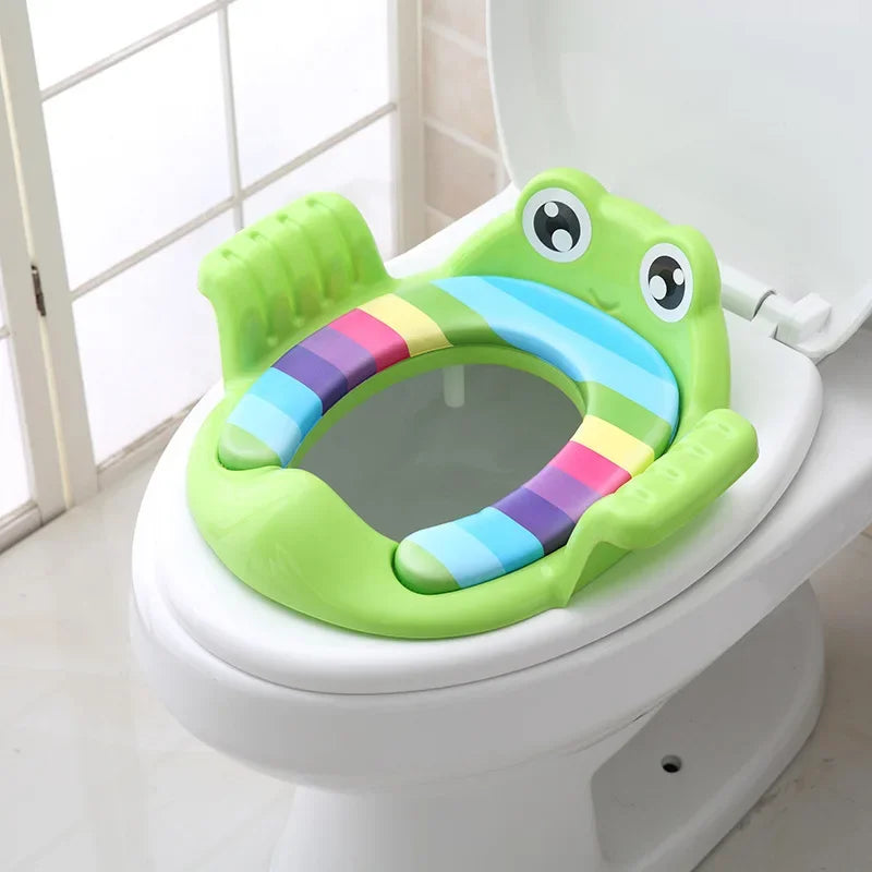 Children's potty seat with frog design on a toilet
