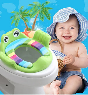 Child sitting on a colorful frog-shaped potty seat with a tropical background