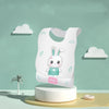 Children's cartoon-patterned apron on a stand with a minimalistic background