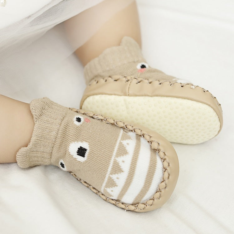 Children's bear-themed socks and mitten set on a white background