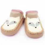 Pair of baby shoes with fox design on a white background