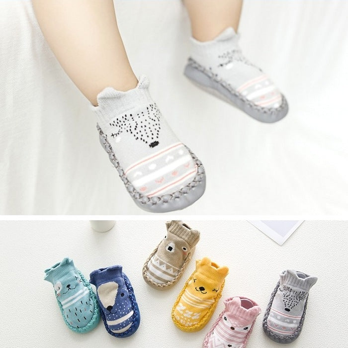 Baby socks with animal designs on a white background