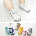 Baby socks with animal designs on a white background
