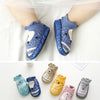 Baby socks with cartoon designs on a white background