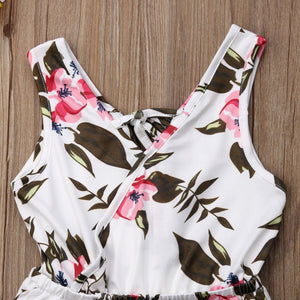 Floral-patterned swimsuit on a wooden surface
