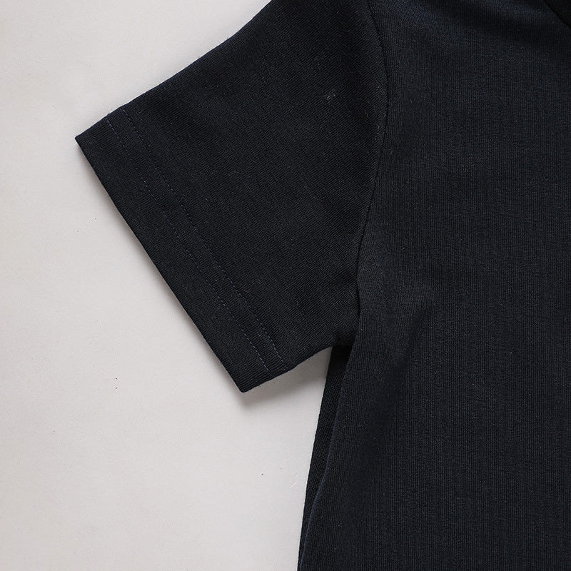 Black t-shirt on a light gray background