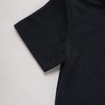 Black t-shirt on a light gray background